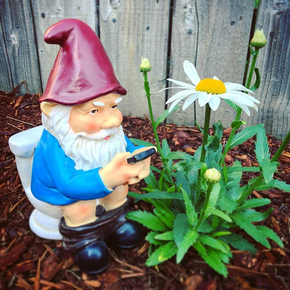 Funny Gnome on the Toilet with Phone