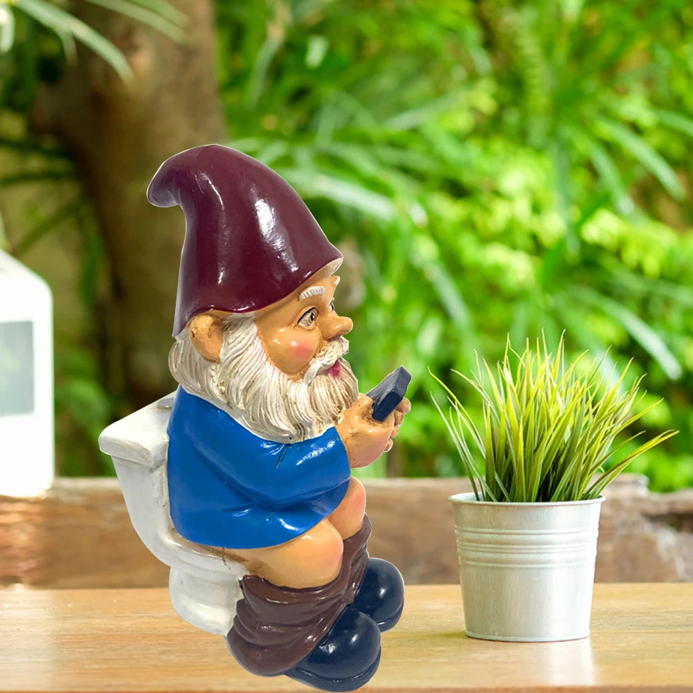 Funny Gnome on the Toilet with Phone