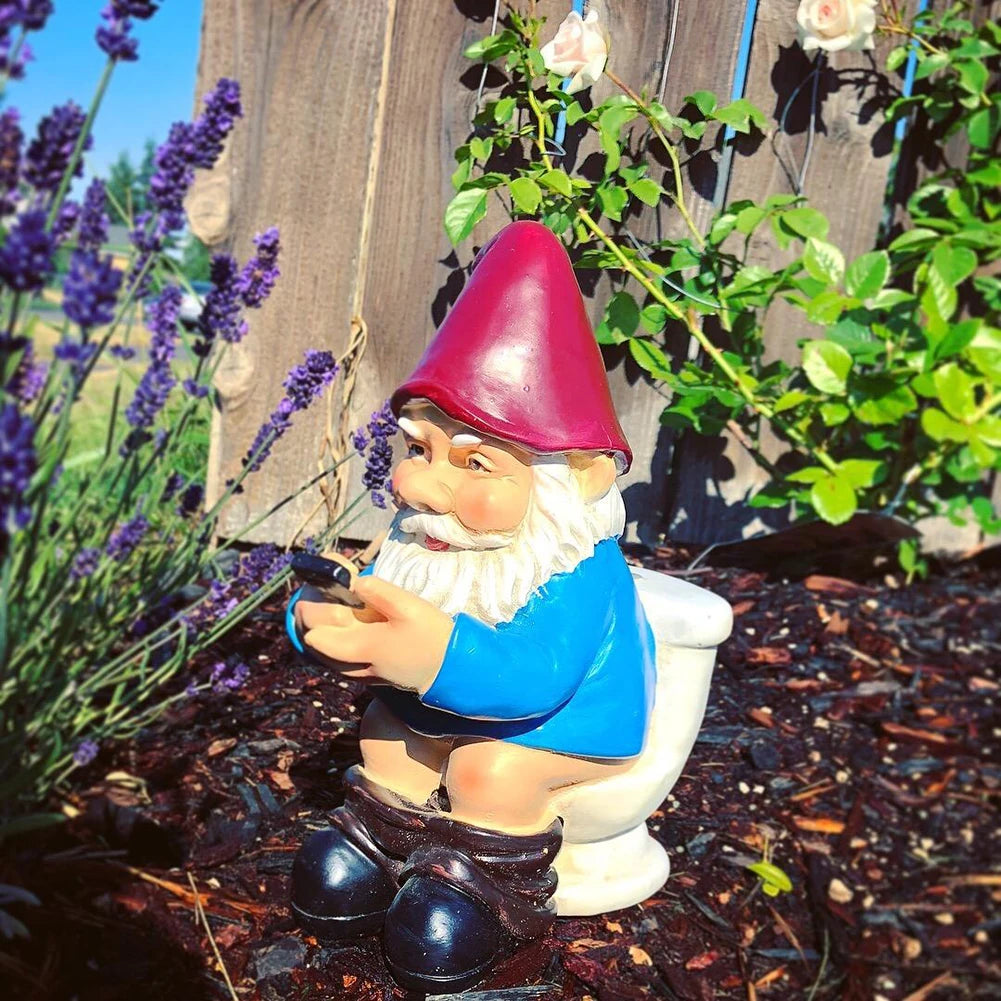Funny Gnome on the Toilet with Phone