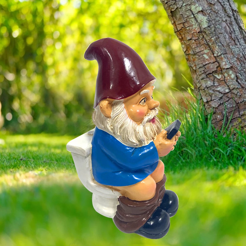 Funny Gnome on the Toilet with Phone