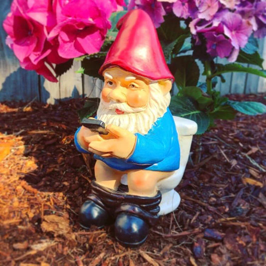Funny Gnome on the Toilet with Phone