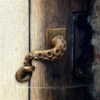 Octopus tentacle handle placed on a door, showing its vivid detail and unique punk-inspired look.