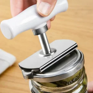 Universal adjustable jar opener twisting off a stubborn vacuum sealed glass jar lid effortlessly