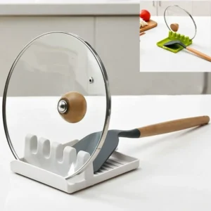 Non-slip heat resistant utensil rest with drip pad holding spatula and pot lid on clean kitchen counter