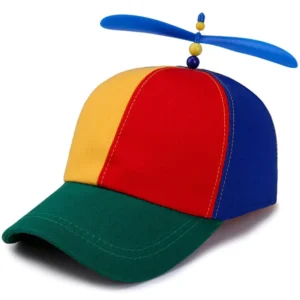 Rainbow propeller hat with a spinning helicopter propeller and rainbow windmill patchwork, worn by a kid at the beach